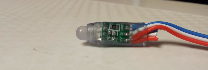 A single 12V WS2811 bullet pixel node with its red, white, and blue wires